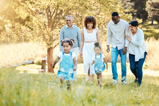 Park, walking and happy family generations for bonding, having fun and talking together. Love, smile and children with parents and grandparents in nature in an outdoor green garden on weekend trip.
