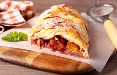 Plum and almond puff pastry strudel