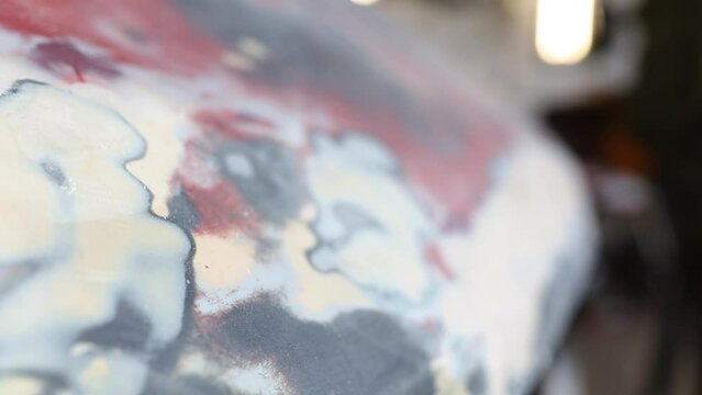 putty texture on a car body, car body repair. Polishing putty
