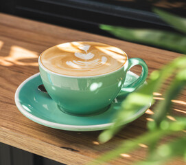 Capuccino served in a green cup