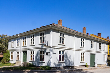 Happy walking in old Fredrikstad on a great warm summer day, with many old buildings, Norway	