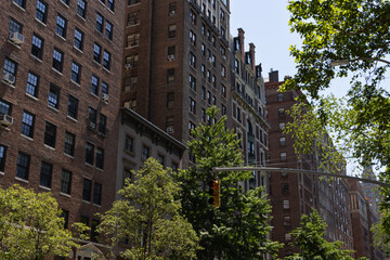 Row of Old Residential Buildings and Skyscrapers along Fifth Avenue in Greenwich Village of New York City