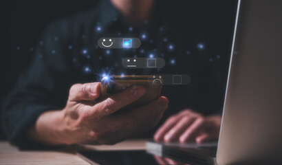 Customer service satisfaction survey concept.Business people or customers show satisfaction by pressing face emoticon smile in satisfaction on virtual touch screen. rating very impressed