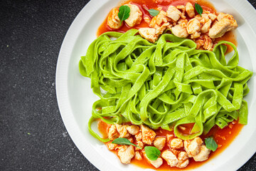 tagliatelle green pasta tomato sauce chicken meat vegetable food meal snack on the table copy space food background rustic top view