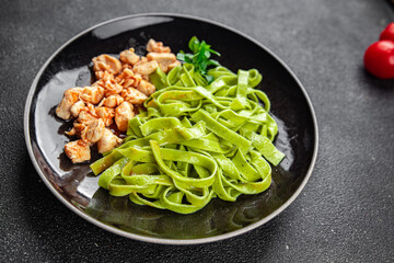 tagliatelle green pasta tomato sauce chicken meat vegetable food meal snack on the table copy space food background rustic top view