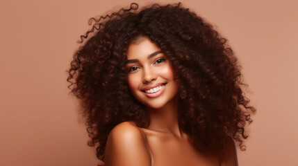 Beauty portrait of african american girl with clean healthy skin on beige background. Smiling dreamy beautiful black woman.Curly hair in afro style