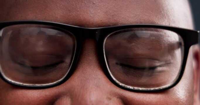 Closeup, eyes and man with glasses, vision and optometry with healthy sight, looking or lens prescription. Person, zoom or eyewear with frames, wellness or human with optical, ophthalmology or retina