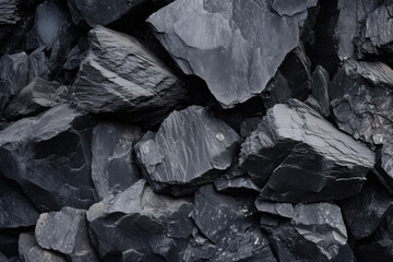Captivatingly Elegant: A Lustrous Background Texture of Anthracite Coal, Showcasing Subtle Hues of Charcoal and Glistening Minerals, a Sustainable Fuel Source and Geological Marvel.