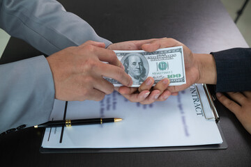 Businessmen pay kickbacks to government officials to facilitate real estate investments and large...