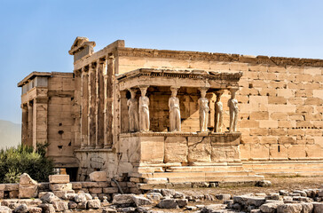 Fototapeta na wymiar Athens, Greece - July 25, 2023: The Erechtheion or Temple of Athena Polias at the Acropolis in Athens 