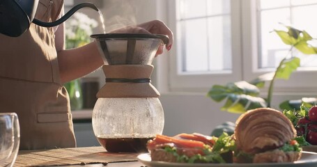 Morning drip filter coffee. Breakfast at home with coffee and croissant sandwiches