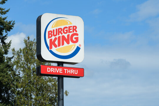 Marysville, WA, USA - September 6, 2023; Tall sign with logo for Burger King with Drive Thru words
