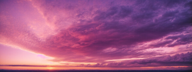 Panoramic view of a pink and purple sky at sunset. Sky panorama background.