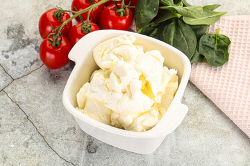Soft cream cheese in the bowl