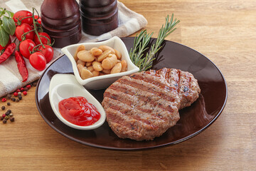 Grilled beef burger cutlet with sauce