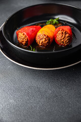 bell pepper meat stuffed pepper paprika stuffing pork, beef, chicken meat meal food snack on the table copy space food background rustic top view 