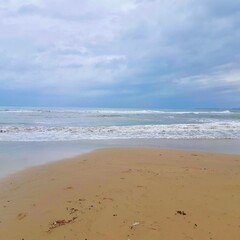 Fototapeta na wymiar Sea. Sand. Clouds. Rain. Travel. Spain