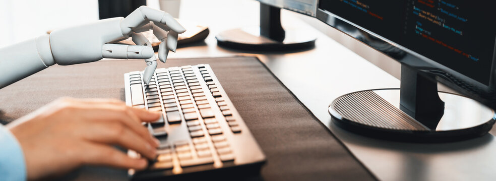 Program coding automation by generative artificial intelligence or AI concept. Collaboration between robotic hand and human software developer solving, debugging or writing script.Trailblazing