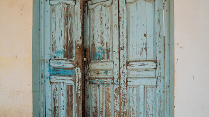Fototapeta na wymiar Old blue wooden door in a mediterranean city, Sousse, Tunisia.