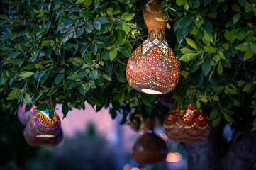 colourful traditional turkish clay lantern on tree branches