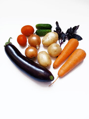 set of vegetables: eggplant, carrot, potato, onion, tomato, cucumber, basil
