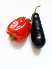 red bell pepper and eggplant on white background