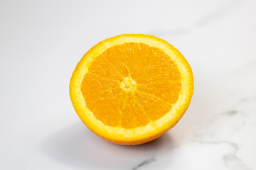 orange cutted in half on a white background