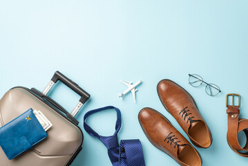 International corporate journey. Top view of tiny plane model, formal attire items – belt,...