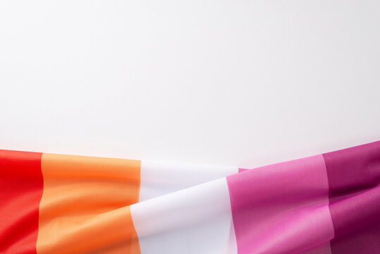 High-angle shot of the Lesbian Pride flag on a blank white canvas for text or promotional content - Powered by Adobe