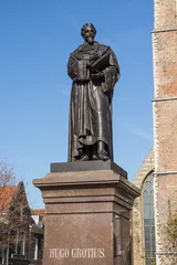 Deurstickers Statue of Hugo de Groot (Standbeeld van Hugo de Groot) New Church (Nieuwe Kerk) in Delft in the state of South Holland (Zuid-Holland) Netherlands (Nederland) © pixs:sell