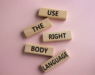 Use the righ Body Language symbol. Concept words Use the righ Body Language on wooden blocks. Beautiful pink background. Business concept. Copy space