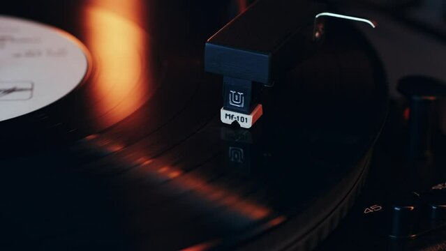 Turntable close-up. Vintage vinyl record player. Close-up shot of a vinyl record and a turntable needle.