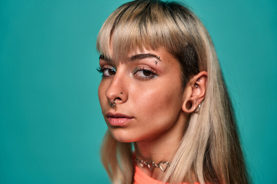 Informal female model with piercing on face