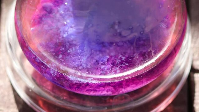 Continuation and termination of the colorful chemical reaction formation of an insoluble purple solid substance - cobalt silicate in sunlight.