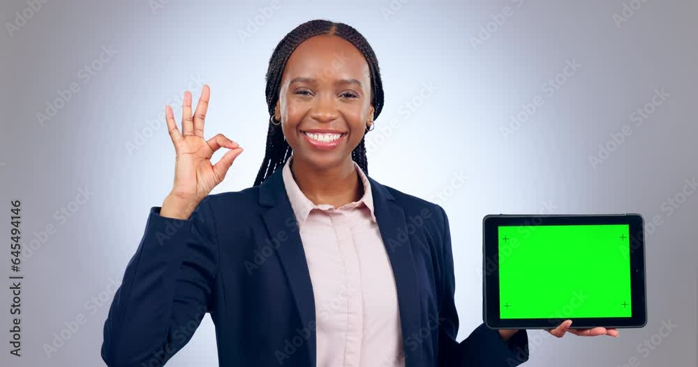 Canvas Prints Happy black woman, tablet and green screen mockup with okay sign against a grey studio background. African female person and technology display or tracking markers in business advertising or approval