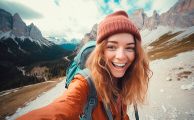Fototapeta na wymiar Alpine Adventure: Young, Happy Traveling Woman Takes a Selfie in the Italian Dolomites.
