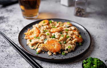 Shrimp  scrambled eggs with scallion in a plate