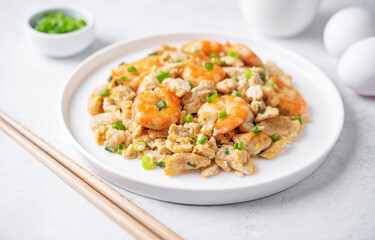 Shrimp  scrambled eggs with scallion in a plate