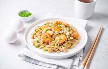 Shrimp  scrambled eggs with scallion in a plate