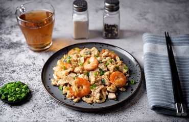 Shrimp  scrambled eggs with scallion in a plate