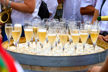 Tasting of sparkling white wine with bubbles champagne on summer festival route of champagne in Cote des Bar, Champagne region, France