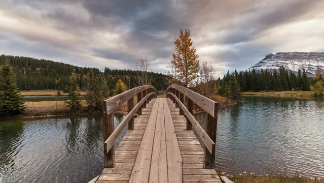 Beautiful Cascade ponds with wooden bridge and mount Rundle in autumn at Banff national park