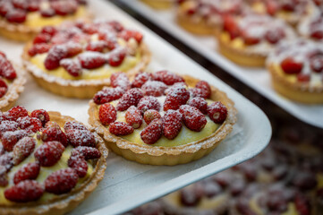 Wild fragolino strawberry and raspberry cakes in ancient city of strawberry Nemi, Castelli Romani, Italy close up