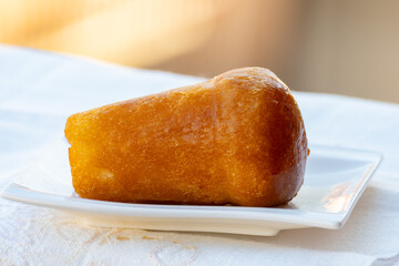Fresh baked italian dessert homemade rum baba soft cake close up