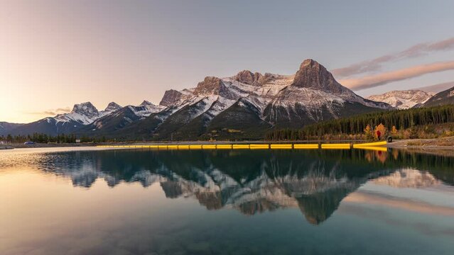 Beautiful sunrise over Rundle Forebay with mount Lawrence Grassi and water reflection