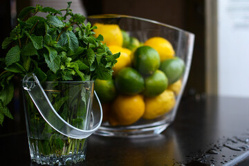 Lemonade, lemons and mint for lemonade. Close-up. Copy space.