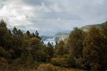 landscape with lake and mountains on hike in Norway on fjord