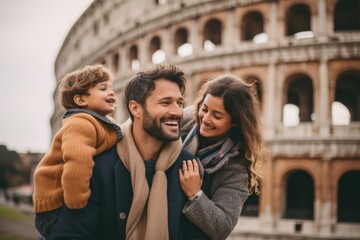 Lifestyle portrait photography of a pleased man in his 30s that is with the family against the Colosseum in Rome Italy