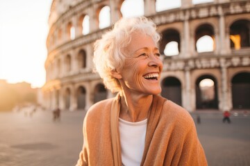 Lifestyle portrait photography of a satisfied woman in her 80s that is with the family against the Colosseum in Rome Italy