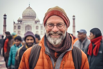 Obraz premium Group portrait photography of a grinning man in his 40s that is smiling with friends in front of the Taj Mahal in Agra India